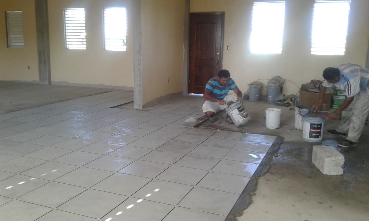 Laying tile flooring down in St. Joseph in Belize