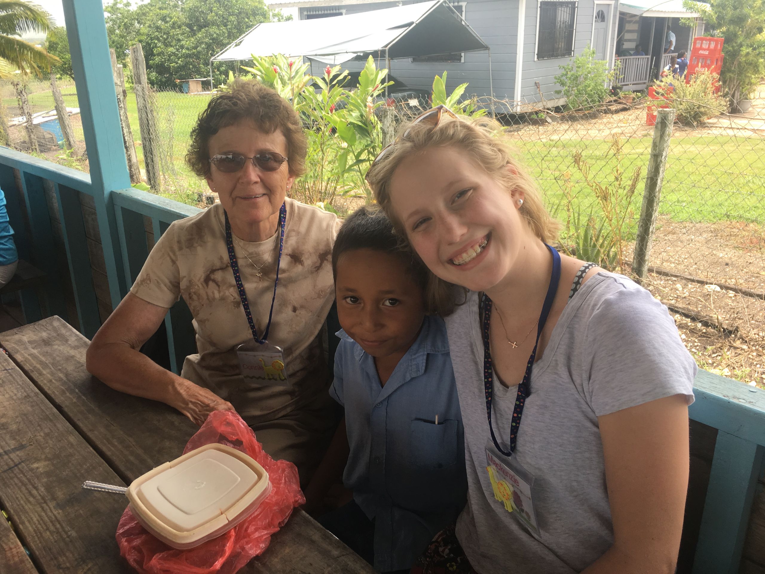 volunteers with a student