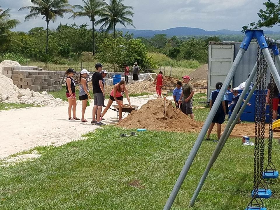 volunteers shoveling dirt