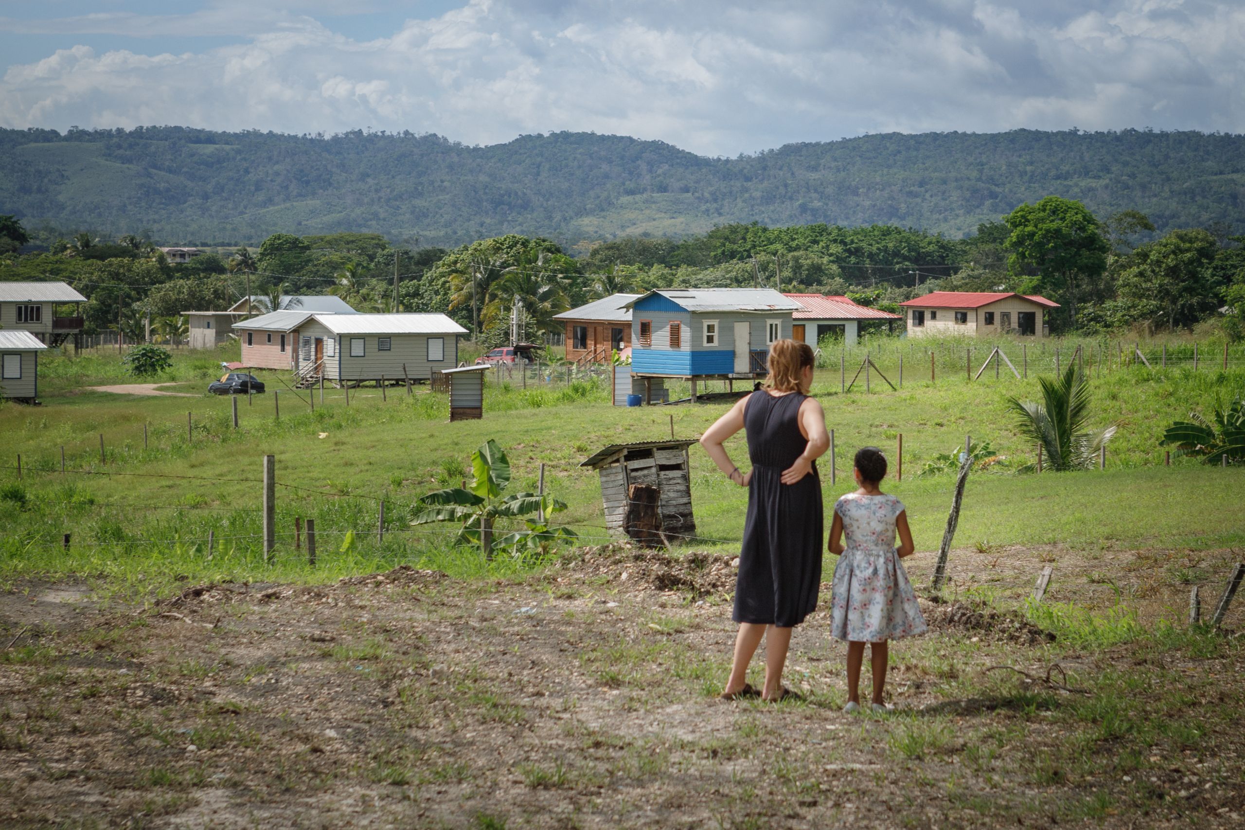 volunteer and girl in a field