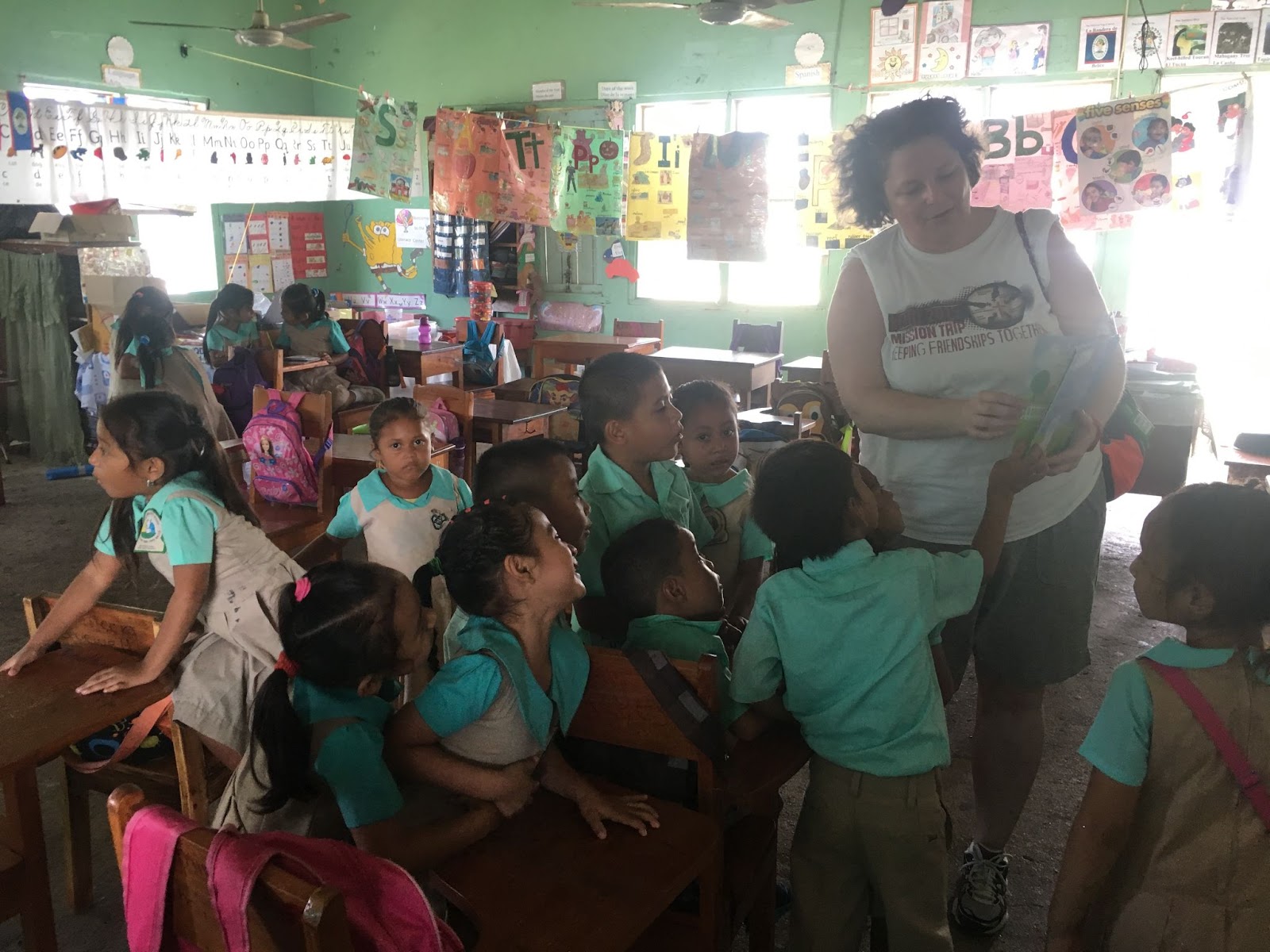 students and volunteer in class